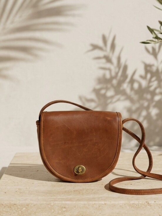 Coach Handbags - Vintage Coach Leather Half Moon Turnlock Crossbody Bag – British Tan
